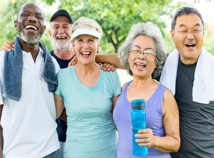 A group of people standing together in the park